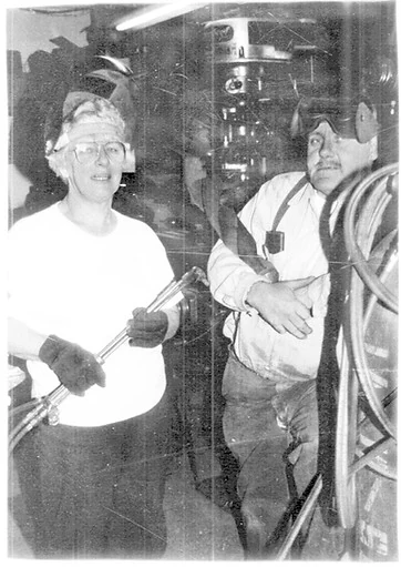 Historical Jack & Sons shop photograph showing two people with welding equipment